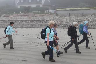Striding across the beach
